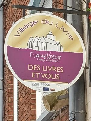 Enseigne village du livre